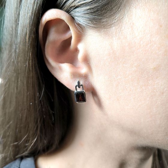 Silver earrings with a 3.81-carat garnet