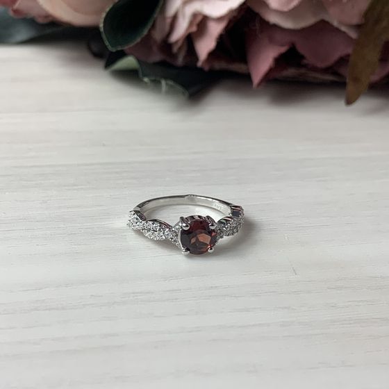 Silver ring with a garnet