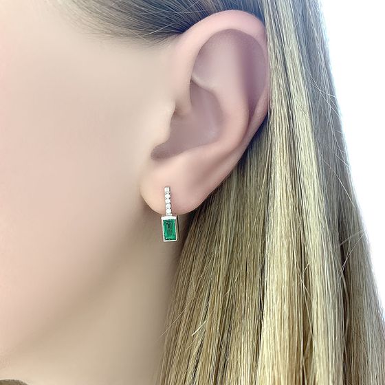 Silver earrings with a 0.795-carat emerald