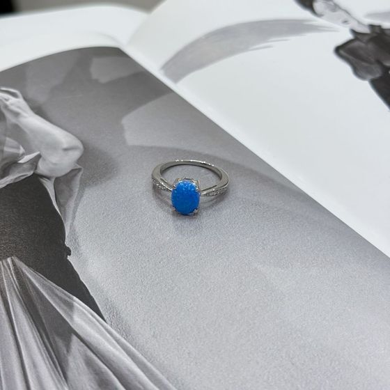 Silver ring with a 0.975-carat opal and cubic zirconia