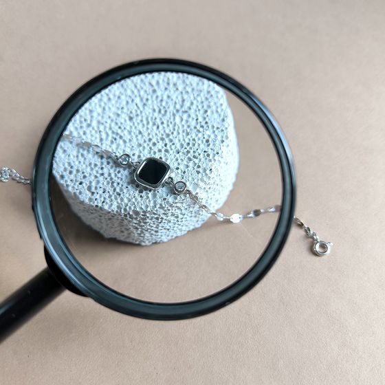 Срібний браслет з оніксом, фіанітами