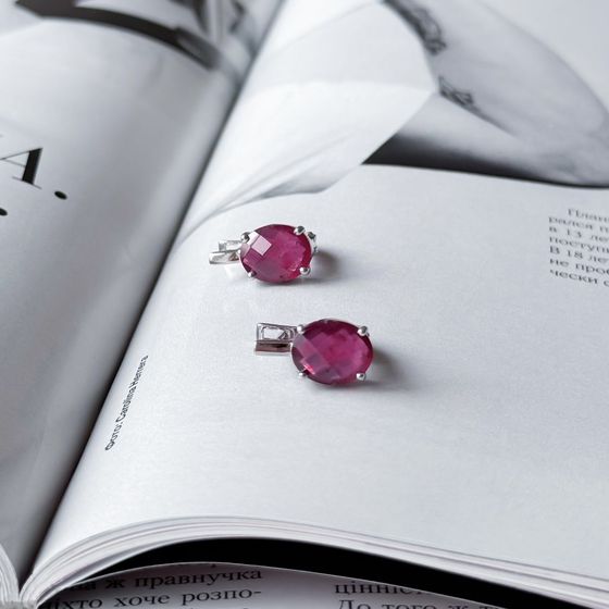 Silver earrings with a 6.458-carat ruby