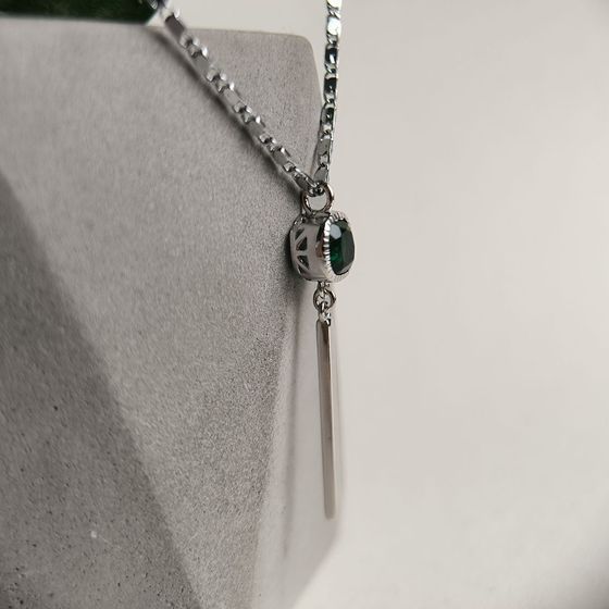 Silver pendant with a 0.605-carat nano emerald