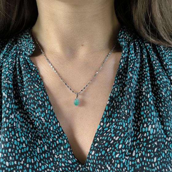 Silver pendant with an emerald and cubic zirconia