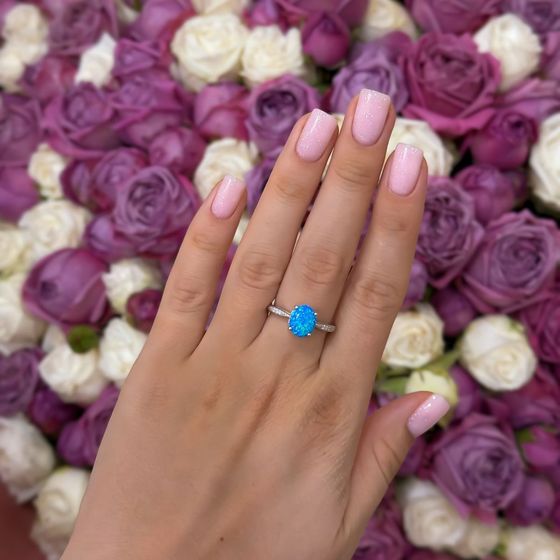 Silver ring with a 0.975-carat opal and cubic zirconia