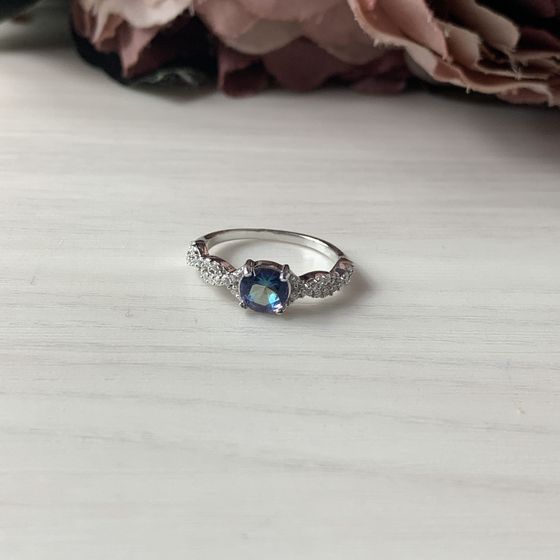 Silver ring with a mystic topaz