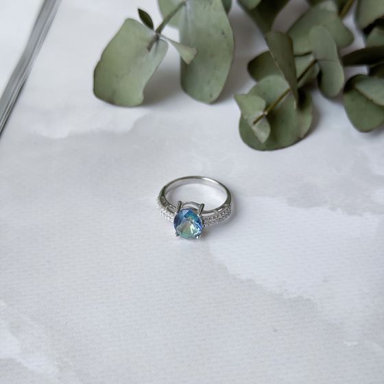 Silver ring with a mystic topaz