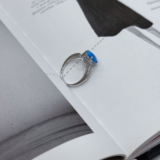 Silver ring with a 0.975-carat opal and cubic zirconia