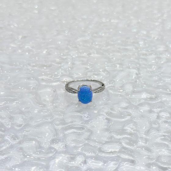 Silver ring with a 0.975-carat opal and cubic zirconia