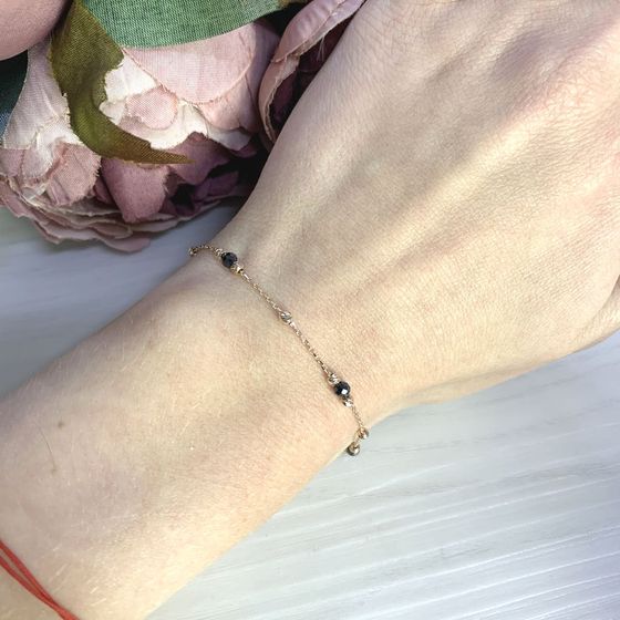 Золотий браслет зі шпінеллю