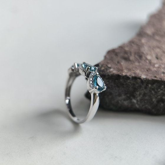 Silver ring with London Blue topaz and cubic zirconia