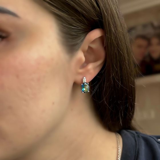 Silver earrings with a 3.817-carat mystic topaz