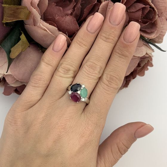 Silver ring with a sapphire, an emerald, and a ruby