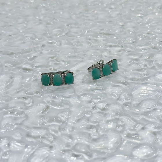 Silver earrings with emerald, fianites