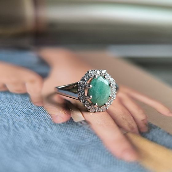 Silver ring with emerald, fianites