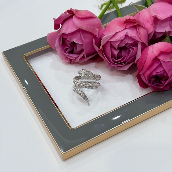 Срібна каблучка з фіанітами, емаллю