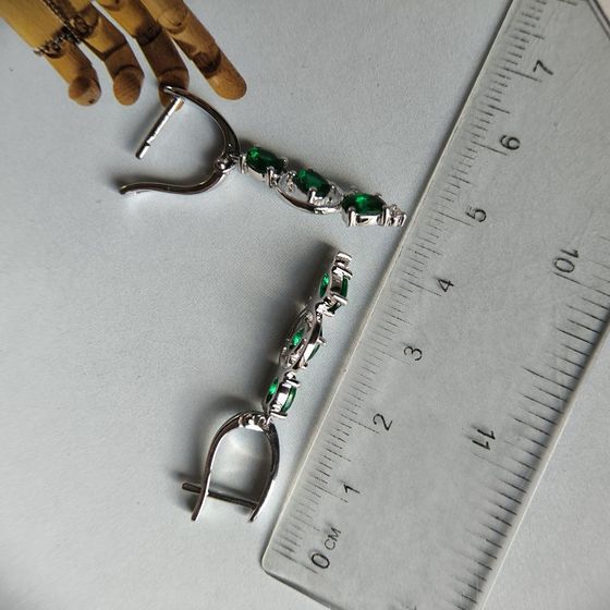 Silver earrings with a 2.338-carat nano emerald