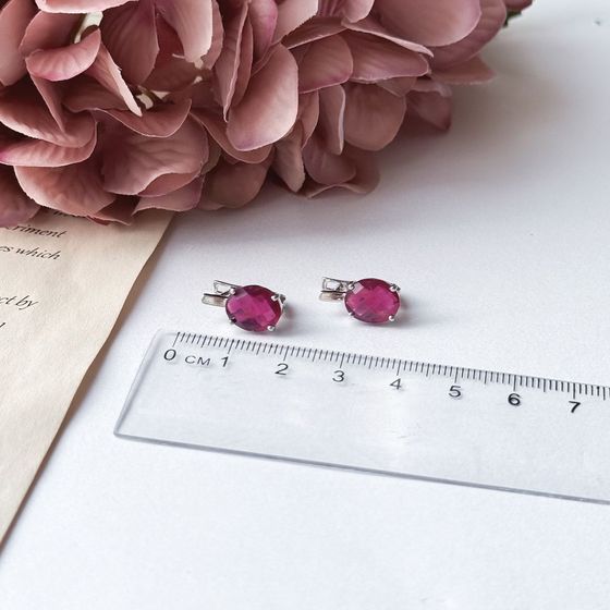 Silver earrings with a 6.458-carat ruby