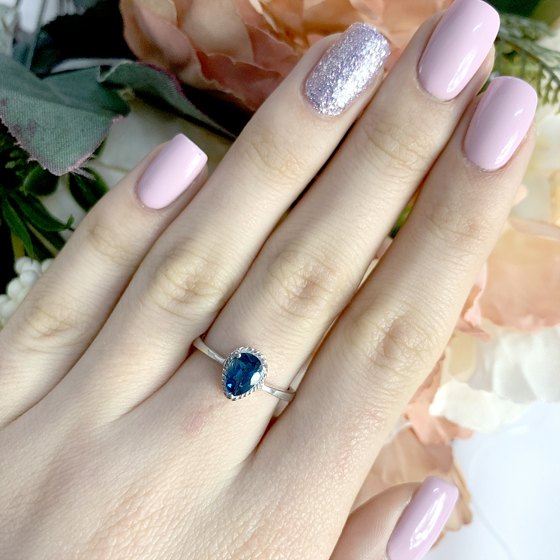 Silver ring with topaz London Blue