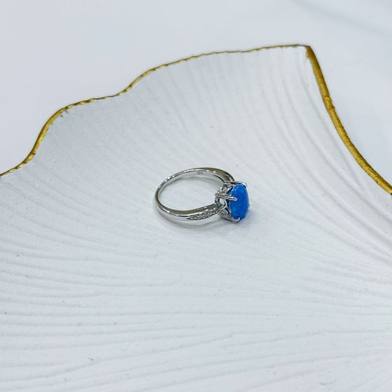 Silver ring with a 0.975-carat opal and cubic zirconia