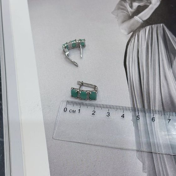 Silver earrings with emerald, fianites