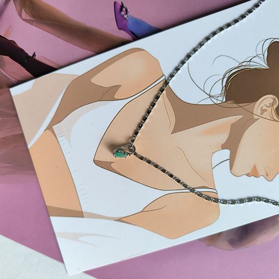 Silver pendant with emerald, fianites