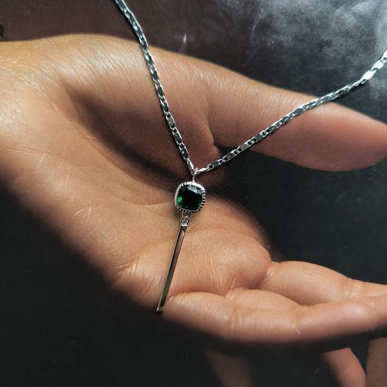 Silver pendant with a 0.605-carat nano emerald