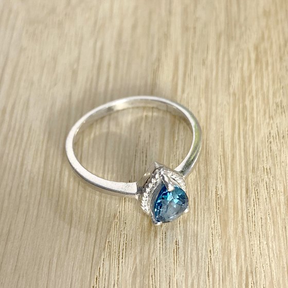 Silver ring with topaz London Blue