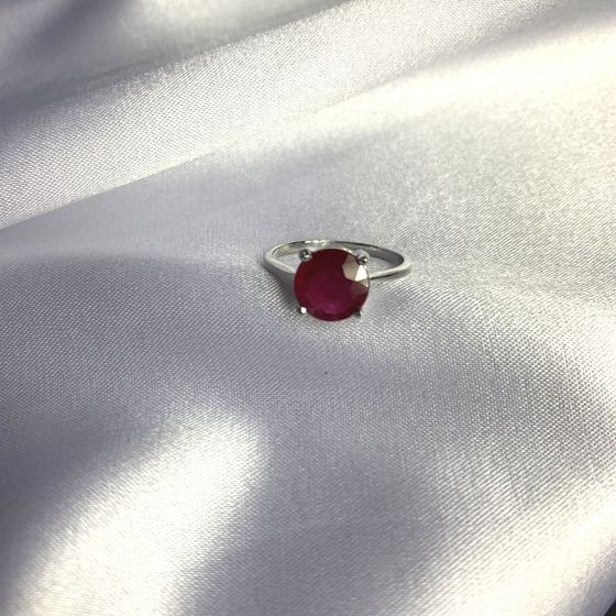 Silver ring with a ruby
