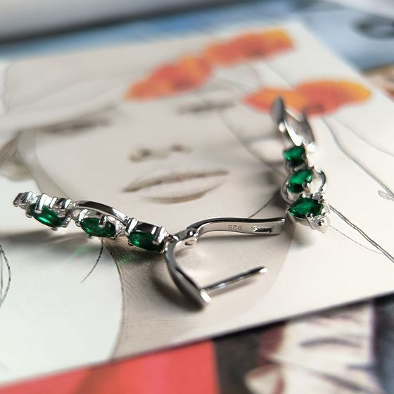 Silver earrings with a 2.338-carat nano emerald