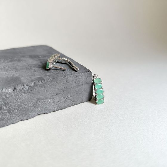 Silver earrings with emerald, fianites