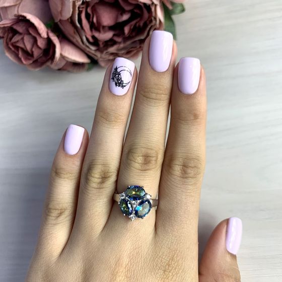 Silver ring with a mystic topaz