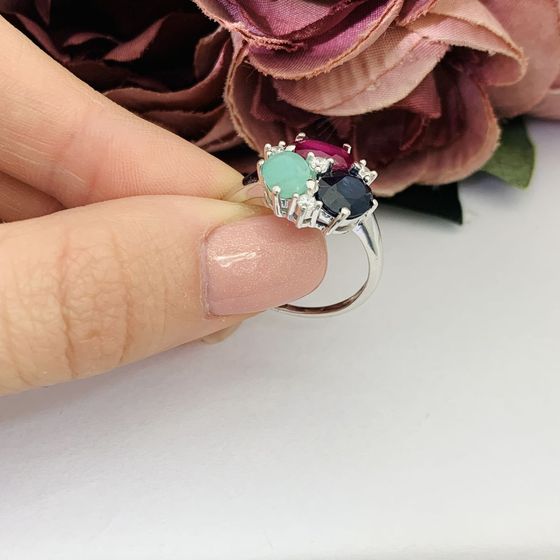 Silver ring with a sapphire, an emerald, and a ruby