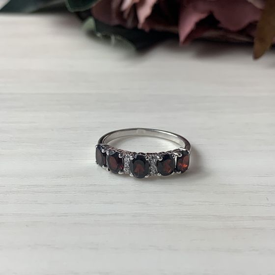 Silver ring with a garnet