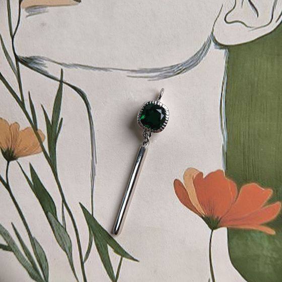 Silver pendant with a 0.605-carat nano emerald