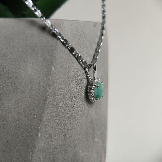 Silver pendant with an emerald and cubic zirconia