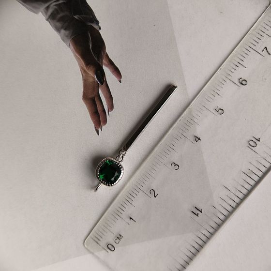 Silver pendant with a 0.605-carat nano emerald