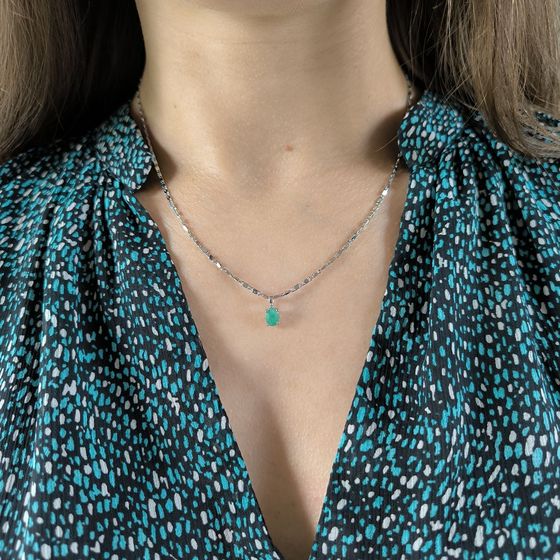 Silver pendant with emerald, fianites