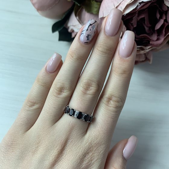 Silver ring with a garnet