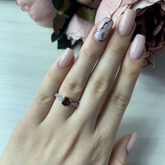 Silver ring with a garnet