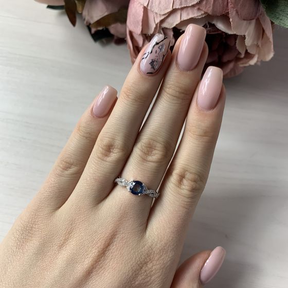 Silver ring with a mystic topaz