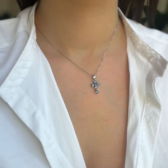 Silver cross with a mystic topaz