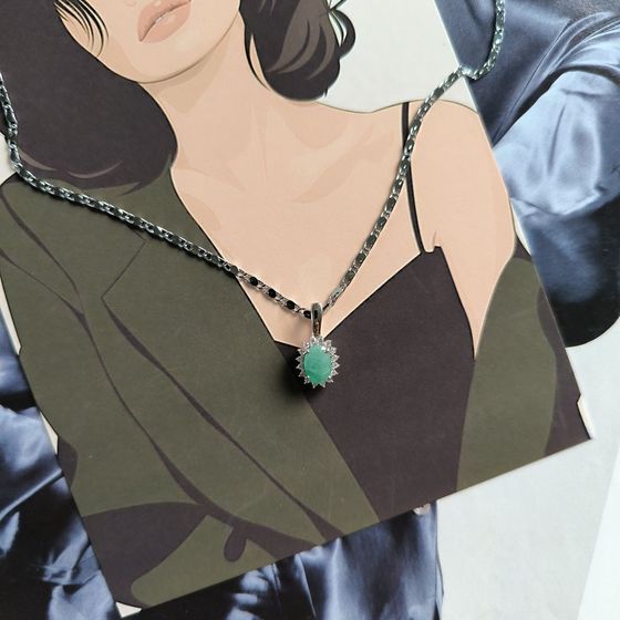 Silver pendant with emerald, fianites