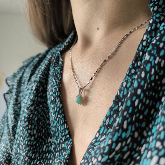 Silver pendant with an emerald and cubic zirconia