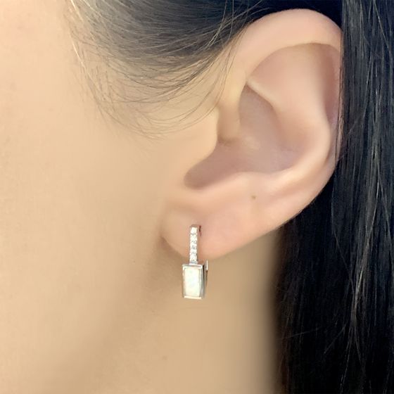 Silver earrings with a 0.395-carat opal