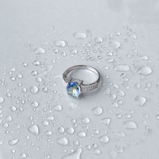 Silver ring with mystic topaz
