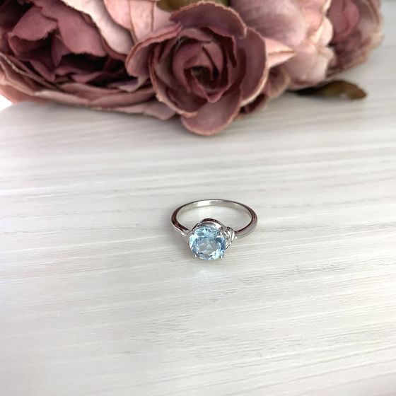 Silver ring with a topaz