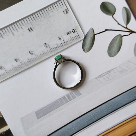 Silver ring with emerald, fianites