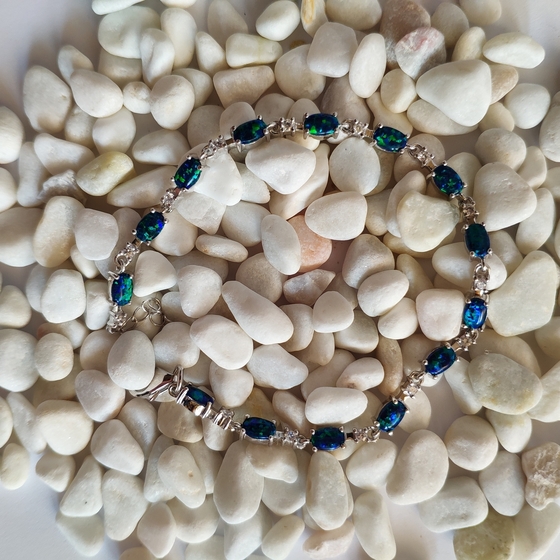Silver bracelet with opal, fianites