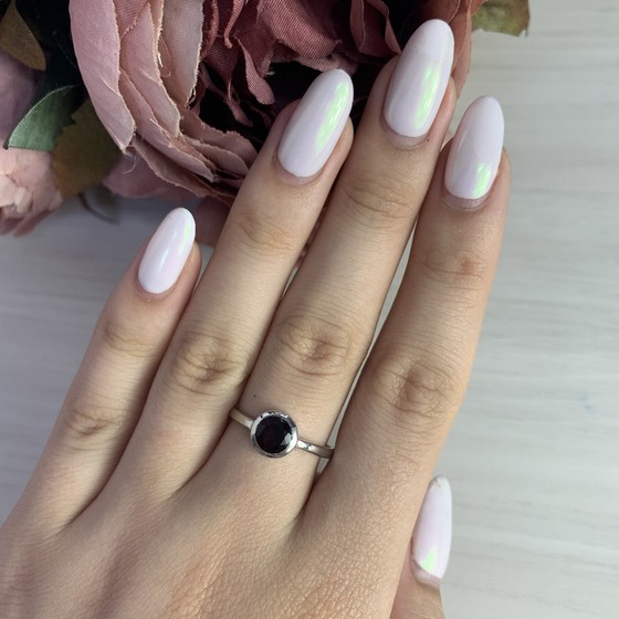 Silver ring with a garnet